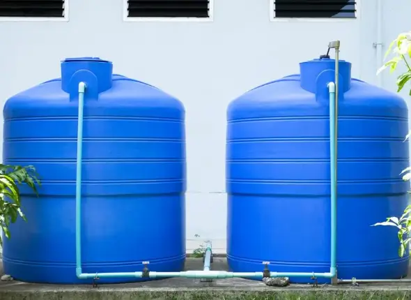 Blue-plastic-water-tanks-1024x651-2 (1) Skilled technician installing blue plastic water tanks. Trust We Fix Plumbing for expert water tank installation service in London.