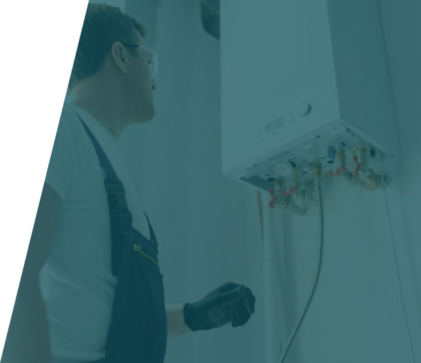 Group-36-(39) Technician setting up a boiler in a residential home, representing boiler installation service in London by We Fix Plumbing London.