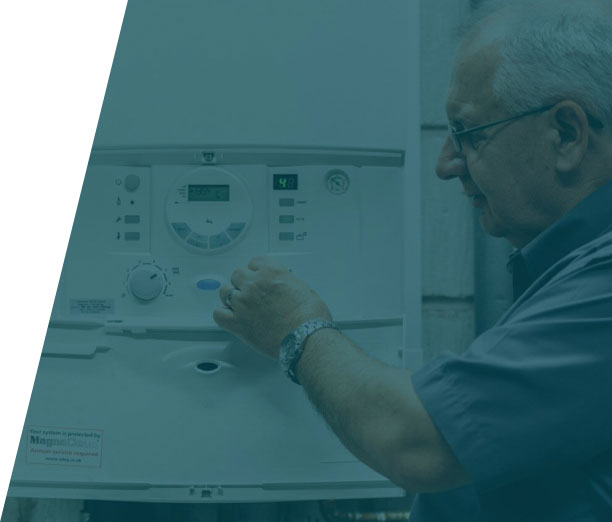 Group-36-(40) Plumber inspecting a boiler system for repairs, highlighting boiler repair service in London by We Fix Plumbing London.