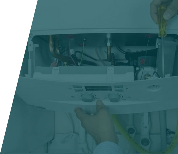 Group-36-(41) Technician using tools to repair a boiler, illustrating boiler repair service in London by We Fix Plumbing London.