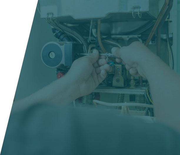 Group-36-(42) Plumber performing maintenance on a boiler, showcasing boiler repair service in London by We Fix Plumbing London.