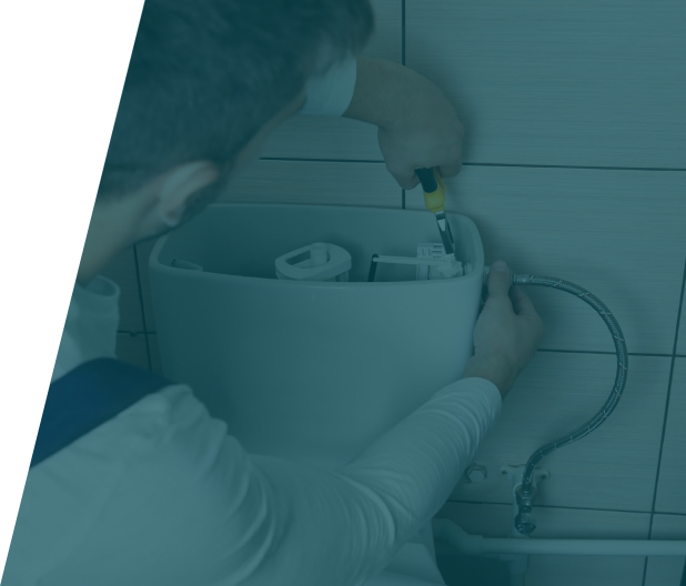 Group 37 (14) Plumber repairing a bidet in a bathroom, representing bidet installation and repair service in London by We Fix Plumbing London