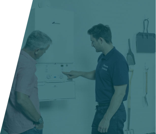 Group-37-(46) Plumber installing and connecting pipes to a new boiler, showcasing boiler installation service in London by We Fix Plumbing London.