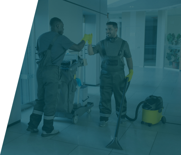 Plumber in a flooded basement using a vacuum for water removal, demonstrating basement flood clean-up service in London by We Fix Plumbing London.
