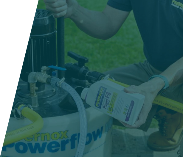 Technician conducting a power flush on a home's heating system, illustrating power flushes service in London by We Fix Plumbing London.