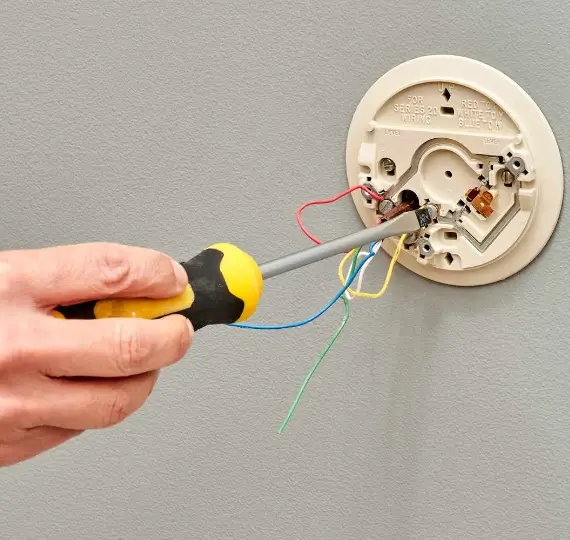 Installation of a smart thermostat by a professional technician. Trust We Fix Plumbing for expert thermostat services in London.