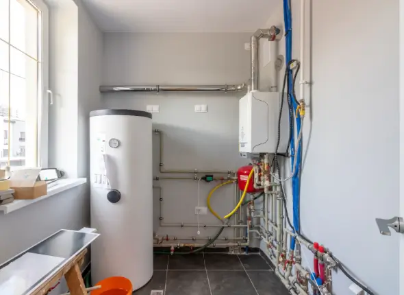 hotwatercyclindertopimage Top view of a hot water cylinder. We Fix Plumbing offers expert vented and unvented cylinder services in London.