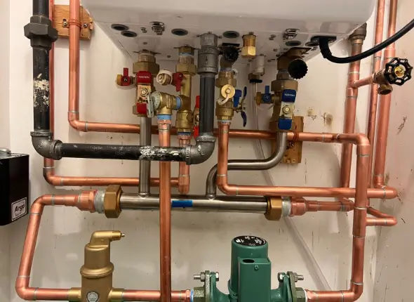 p11 Professional plumber detecting and repairing gas leak in a London property, ensuring safety and reliability.