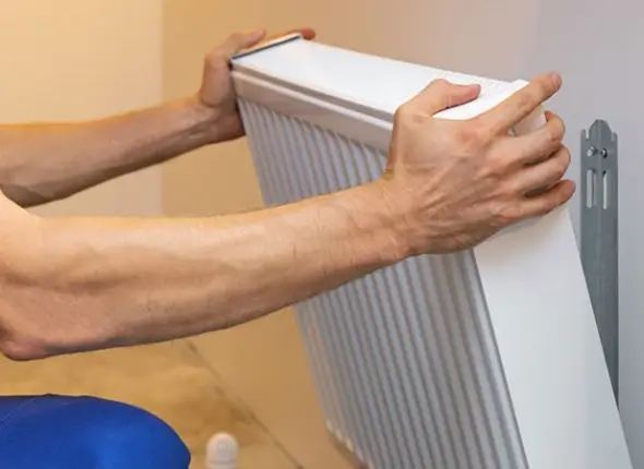 Expert radiator installation service in London provided by WeFixPlumbing. A close-up of a newly installed radiator, showcasing quality craftsmanship and attention to detail.